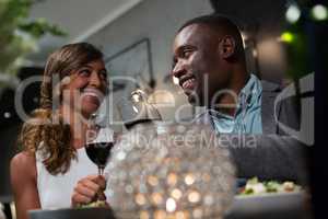 Happy couple toasting wine