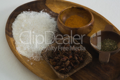 Various spices and salt in tray