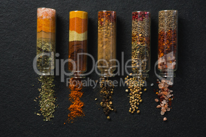 Various spices spilled out of jar
