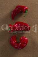 Red chili pepper on brown background