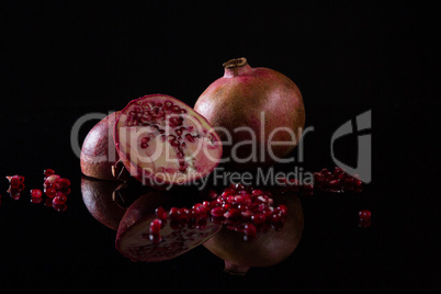 Pomegranate on black background