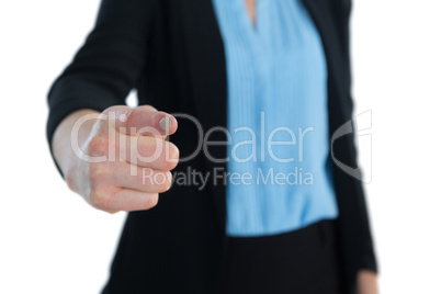 Mid section of businesswoman touching imaginary interface
