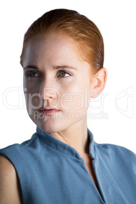 Thoughtful young businesswoman with gray eyes