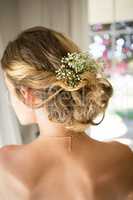 Close up of bride blond hair with flowers