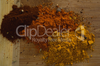 Spices powder on wooden board