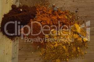 Spices powder on wooden board