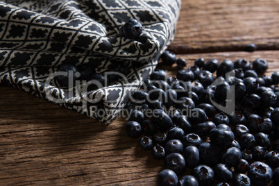 Blueberries and napkin on wooden table