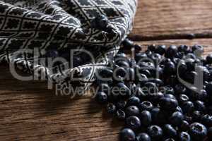 Blueberries and napkin on wooden table