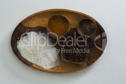 Various spices and salt in tray