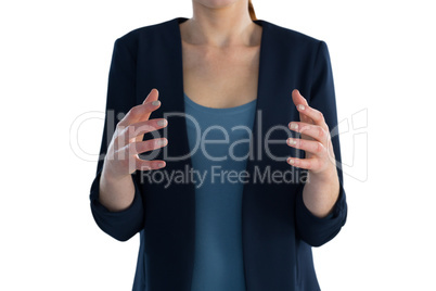 Mid section of businesswoman gesturing during presentation