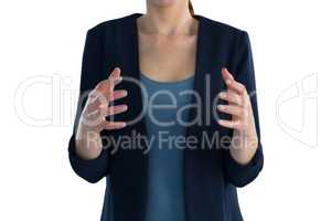 Mid section of businesswoman gesturing during presentation
