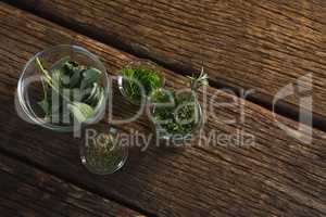 Various herbs in a jar on wooden table