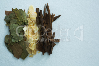 Bay leaf, spice and cinnamon on white background