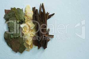 Bay leaf, spice and cinnamon on white background