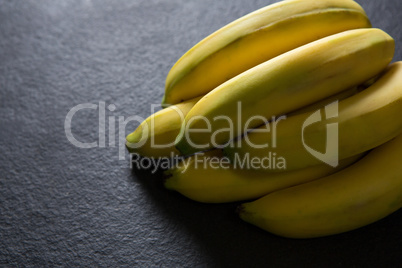 Fresh organic banana on black background