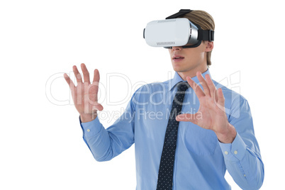 Young businessman gesturing while wearing futuristic headset