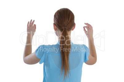 Rear view of businesswoman touching imaginary interface