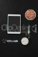 Various salt in bowl with digital tablet