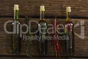 Olive oil bottles with herbal and spices