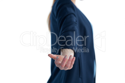 Side view of businesswoman holding invisible imaginary product