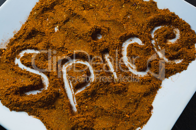 Word spice written on red chili powder