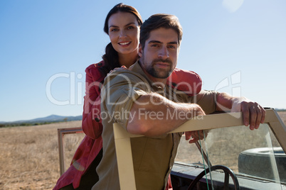 Portrait of young couple in off road vehicle