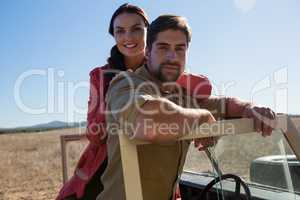 Portrait of young couple in off road vehicle