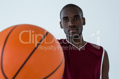 Confident player holding basketball