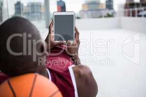 Basketball player using digital tablet