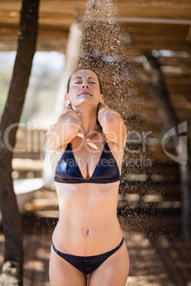 Woman taking bath in shower
