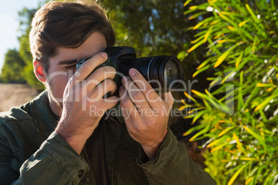 Close-up of man photographing