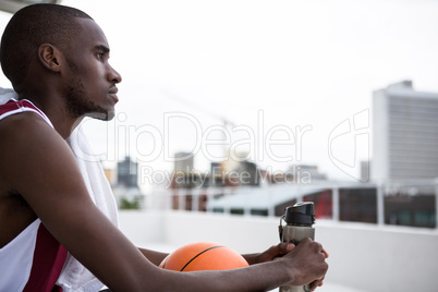 Player relaxing on terrace