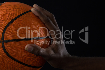 Close-up of player holding basketball