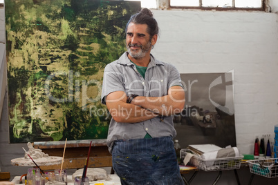 Confident man standing with arms crossed