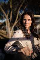 Portrait of confident woman sitting in vehicle