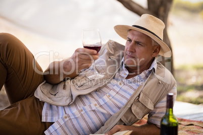 Man having wine in cottage