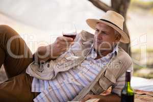 Man having wine in cottage
