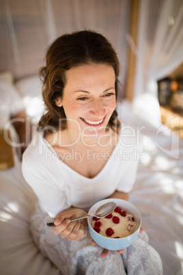 Happy woman having breakfast