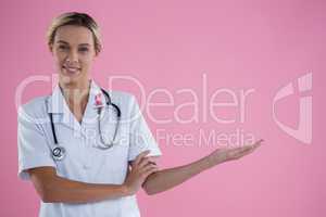 Portrait of young female doctor gesturing