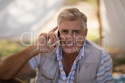 Happy man talking on mobile phone