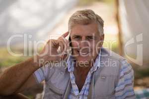 Happy man talking on mobile phone