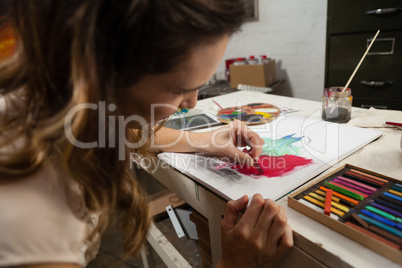 Woman painting a sketch