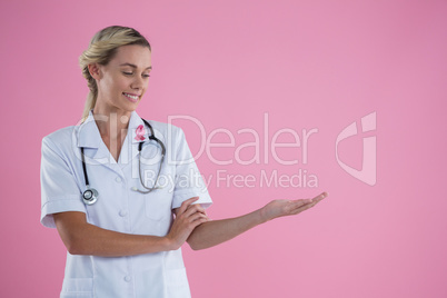 Smiling young female doctor gesturing