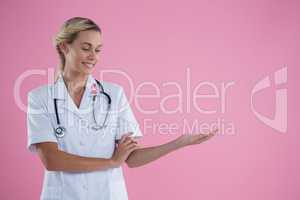 Smiling young female doctor gesturing