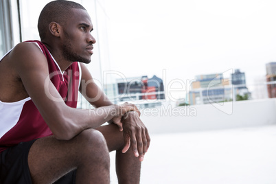 Player sitting on terrace