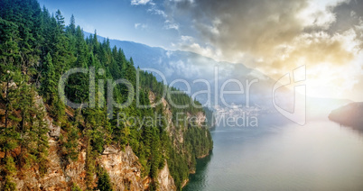 Mountain by river against sky