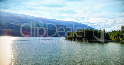 Idyllic view of river by mountains