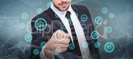 Composite image of smart businessman in suit pointing at camera