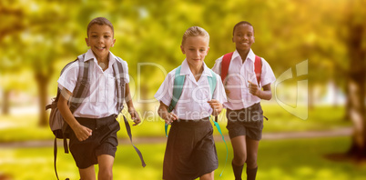 Composite image of students running against white background