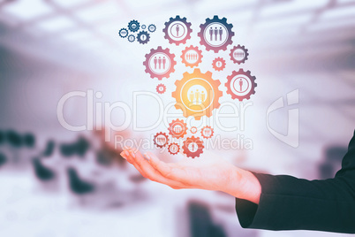 Composite image of businesswomans arm presenting